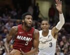 Miami Heat's Derrick Jones Jr. (5) drives past Cleveland Cavaliers' Patrick McCaw (3) in the second half of an NBA basketball game, Wednesday, Jan. 2, 2019, in Cleveland. Miami won 117-92. (AP Photo/Tony Dejak)