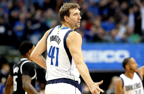 Dallas Mavericks forward Dirk Nowitzki (41) of Germany gestures after sinking a three-point basket in the second half of an NBA basketball game against the Brooklyn Nets in Dallas, Friday, March 10, 2017. (AP Photo/Tony Gutierrez)