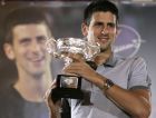 Serbian tennis player Novak Djokovic, ranked 3rd on the ATP list of the world's best tennis players, holds the trophy during a welcome ceremony, in Belgrade, Serbia, Saturday, Feb. 2, 2008. Djokovic beat Jo-Wilfried Tsonga of France to win the men's singles at the Australian Open tennis championships on Jan 27. (AP Photo/Darko Vojinovic)