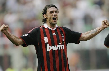 FILE - AC Milan defender Paolo Maldini salutes his fans at the end of his last match at the San Siro stadium, after 24 years and 901 games for the club, on May 24, 2009. AC Milan's Fikayo Tomori could hardly have dreamt of a better start to life at AC Milan. The English defender helped Milan win the Serie A title in his first full season with the club and the Rossoneri are now back at the top of European soccer.  (AP Photo/Alberto Pellaschiar, File)