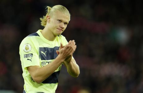 Manchester City's Erling Haaland applauds to supporters at the end of the English Premier League soccer match between Liverpool and Manchester City at Anfield stadium in Liverpool, Sunday, Oct. 16, 2022. (AP Photo/Jon Super)