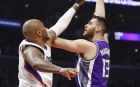 Sacramento Kings center Georgios Papagiannis shoots over Los Angeles Clippers center Marreese Speights, left, during the first half of an NBA basketball game, Sunday, March 26, 2017, in Los Angeles. (AP Photo/Danny Moloshok)