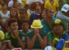 FORTALEZA, BRAZIL - JUNE 12:  Brazil fans react to the the early own goal scored by Marcelo at the FIFA Fan Fest on June 12, 2014 in Fortaleza, Brazil.  (Photo by Laurence Griffiths/Getty Images)