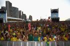 FORTALEZA, BRAZIL - JUNE 12:  Brazil fans celebrate the first goal scored by Neymar at the FIFA Fan Fest on June 12, 2014 in Fortaleza, Brazil.  (Photo by Laurence Griffiths/Getty Images)