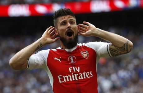 Arsenal's Olivier Giroud celebrates after Aaron Ramsey scored their side's second goal during the English FA Cup final soccer match between Arsenal and Chelsea at Wembley stadium in London, Saturday, May 27, 2017. (AP Photo/Kirsty Wigglesworth)