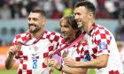 Croatia's Mateo Kovaci, left, Croatia's Luka Modric, center, Croatia's Ivan Perisic, right, pose with their broze medal for their third place the World Cup third-place award ceremony at Khalifa International Stadium in Doha, Qatar, Saturday, Dec. 17, 2022. Croatia defeated Morocco 2-1 for third place. (AP Photo/Andre Penner)