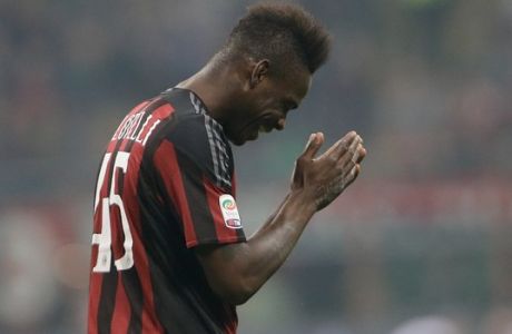 AC Milan's Mario Balotelli gestures after missing a scoring chance during a Serie A soccer match between AC Milan and Juventus, at the San Siro stadium in Milan, Italy, Saturday, April 9, 2016. (AP Photo/Luca Bruno)