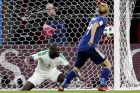 Japan's Keisuke Honda, right, scores his side's second goal past Senegal's Kalidou Koulibaly during the group H match between Japan and Senegal at the 2018 soccer World Cup at the Yekaterinburg Arena in Yekaterinburg , Russia, Sunday, June 24, 2018. (AP Photo/Natacha Pisarenko)