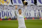 Real Madrid's Cristiano Ronaldo holds up one of his five Golden Ball trophy prior the Spanish La Liga soccer match between Real Madrid and Sevilla at the Santiago Bernabeu stadium in Madrid, Saturday, Dec. 9, 2017. (AP Photo/Francisco Seco)