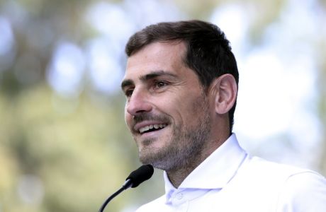FILE - In this Monday, May 6, 2019 file photo, Spanish goalkeeper Iker Casillas talks to journalists outside a hospital in Porto, Portugal. Former Spain and Real Madrid goalkeeper Iker Casillas said Monday June 15, 2020, he will not run for president of the Spanish soccer federation. Casillas said the main reason that led him to change his mind was the exceptional social, economic and health situation that our country is suffering. (AP Photo/Luis Vieira, File)