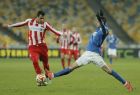 Dnipro's Nikola Kalinic, right, and Olympiacos' Luka Milivojevic battle for the ball during a Europa League round of 32 first leg soccer match between Dnipro Dnipropetrovsk and Olympiacos at Olimpiyskiy Stadium in Kiev, Ukraine, Thursday, Feb. 19, 2015. (AP Photo/Efrem Lukatsky)