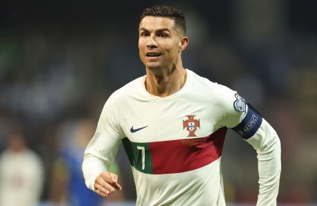 FILE - Portugal's Cristiano Ronaldo reacts after scoring during the Euro 2024 group J qualifying soccer match against Bosnia-Herzegovina at the Bilino Polje Stadium in Zenica, Bosnia and Herzegovina, Oct. 16, 2023. Ronaldo has been hit with a billion dollar class-action lawsuit over his role in promoting cryptocurrency-related non-fungible tokens, or NFTs, issued by the beleaguered cryptocurrency exchange Binance. The lawsuit, filed in federal court in the Southern District of Florida Monday, Nov. 27, 2023 accuses Ronaldos promotions of Binance of being deceptive and unlawful. (AP Photo/Armin Durgut, file)