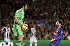 Juventus goalkeeper Gianluigi Buffon catches the ball ahead of Barcelona's Lionel Messi, right, during the Champions League quarterfinal second leg soccer match between Barcelona and Juventus at Camp Nou stadium in Barcelona, Spain, Wednesday, April 19, 2017. (AP Photo/Emilio Morenatti)