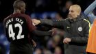 Manchester City's Yaya Toure, who scored both their goals, left, celebrates with his head coach Pep Guardiola after the English Premier League soccer match between Crystal Palace and Manchester City at Selhurst Park stadium in London, Saturday, Nov. 19, 2016. (AP Photo/Matt Dunham)