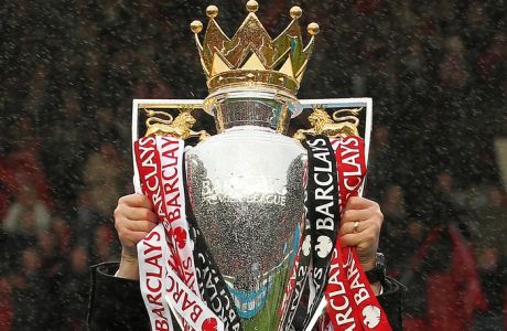 The Barclays Premier League 2013 trophy decked in the colours of Manchester United.