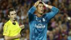 Real Madrid's Cristiano Ronaldo, right, reacts after Referee Ricardo de Burgos shows a second yellow card during the Spanish Supercup, first leg, soccer match between FC Barcelona and Real Madrid at the Camp Nou stadium in Barcelona, Spain, Sunday, Aug. 13, 2017. Cristiano Ronaldo was banned for five games on Monday after shoving a referee following his red card for diving in Real Madrid's 3-1 win over Barcelona in the season-opening Spanish Super Cup. (AP Photo/Manu Fernandez)