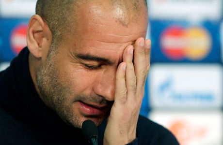Bayern head coach Pep Guardiola of Spain gestures during a press conference in Munich, southern Germany, Tuesday, April 8, 2014. Bayern Munich will play Manchester United in a Champions League quarter final second leg soccer match on Wednesday. (AP Photo/Matthias Schrader)