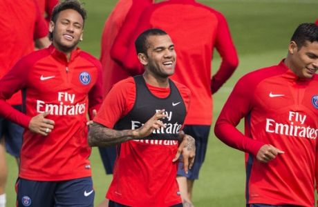 From left, Paris Saint-Germain's Neymar, Dani Alves and Thiago Silva during a training session at the Camp des Loges training center in Saint Germain en Laye, west of Paris, Friday, Aug. 11, 2017. (AP Photo/Kamil Zihnioglu)