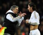 Real Madrid's Portuguese coach Jose Mourinho (L) chats with Real Madrid's defender Sergio Ramos (R) after he received a red card during the second leg of the Spanish Cup quarter-final "El clasico" football match Barcelona vs Real Madrid at the Camp Nou stadium in Barcelona on January 25, 2012.  AFP PHOTO/JAVIER SORIANO (Photo credit should read JAVIER SORIANO/AFP/Getty Images)
