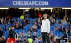 Liverpool's head coach Juergen Klopp watches the players warm up before the English Premier League soccer match between Chelsea and Liverpool at Stamford Bridge stadium in London, Friday, Sept. 16, 2016. (AP Photo/Frank Augstein)
