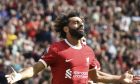 Liverpool's Mohamed Salah celebrates after scoring his sides second goal during the Premier League soccer match between Liverpool and AFC Bournemouth at Anfield, in Liverpool, England, Saturday, Aug. 19, 2023. (AP Photo/Rui Vieira)
