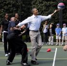 President Barack Obama plays basketball with former NBA basketball player Bruce Bowen during the annual White House Easter Egg Roll, Monday, April 9, 2012, at the White House in Washington. (AP Photo/Carolyn Kaster)