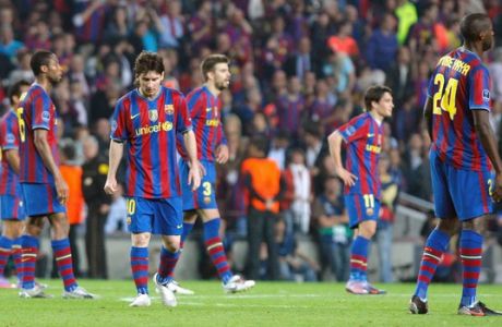 FC Barcelona's, from left to right, Seydou Keita of Mali, Lionel Messi of Argentina, Gerard Pique, Bojan Krkic, Gnegneri Toure Yaya of the Ivory Coast react, at  the end of a Champions League semifinal soccer match, second leg, between Barcelona and Inter Milan, at the Nou Camp stadium in Barcelona, Spain, Wednesday, April 28, 2010. Inter lost the match 0-1, but went through to the final 3-2 on aggregate. (AP Photo/Andres Kudacki)