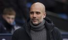 Manchester City's head coach Pep Guardiola smiles before the English Premier League soccer match between Manchester City and Wolverhampton at the Etihad Stadium in Manchester, England, Sunday, Jan. 22, 2023. (AP Photo/Dave Thompson)