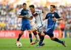 RIO DE JANEIRO, BRAZIL - JULY 13:  Mesut Oezil of Germany and Lucas Biglia of Argentina compete for the ball during the 2014 FIFA World Cup Brazil Final match between Germany and Argentina at Maracana on July 13, 2014 in Rio de Janeiro, Brazil.  (Photo by Shaun Botterill - FIFA/FIFA via Getty Images)