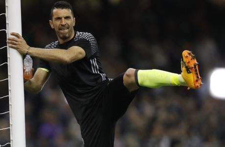 Juventus goalkeeper Gianluigi Buffon stretches before the Champions League final soccer match between Juventus and Real Madrid at the Millennium stadium in Cardiff, Wales Saturday June 3, 2017. (AP Photo/Frank Augstein)