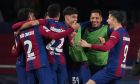 Barcelona's Robert Lewandowski, right, celebrates with his teammates after scoring his side's third goal during the Champions League, round of 16, second leg soccer match between Barcelona and SSC Napoli at the Olympic Lluis Companys stadium in Barcelona, Spain, Tuesday, March 12, 2024. (AP Photo/Emilio Morenatti)