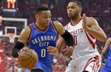 Oklahoma City Thunder guard Russell Westbrook (0) drives past Houston Rockets guard Eric Gordon during the first half in Game 2 of an NBA basketball first-round playoff series, Wednesday, April 19, 2017, in Houston. (AP Photo/Eric Christian Smith)