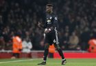 Manchester United's Paul Pogba leaves the pitch after being shown a red card during the English Premier League soccer match between Arsenal and Manchester United at the Emirates stadium in London, Saturday, Dec. 2, 2017. (AP Photo/Kirsty Wigglesworth)