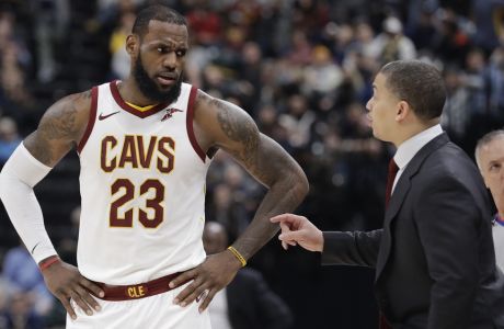 Cleveland Cavaliers head coach Tyronn Lue, front right, talks with LeBron James during the second half of an NBA basketball game against the Indiana Pacers, Friday, Jan. 12, 2018, in Indianapolis. (AP Photo/Darron Cummings)
