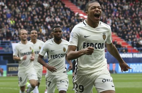 Monaco's Kylian Mbappe celebrates after scoring his first goal during their French League One soccer match against Caen, in Caen, north western France, Sunday, March 19, 2017. Mbappe scored two goals as Monaco won 3-0. (AP Photo/David Vincent)