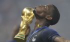 France's Paul Pogba celebrates with the trophy after the final match between France and Croatia at the 2018 soccer World Cup in the Luzhniki Stadium in Moscow, Russia, Sunday, July 15, 2018. (AP Photo/Natacha Pisarenko)
