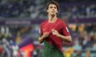 Portugal's Joao Felix, left, celebrates after scoring his sides second goal during the World Cup group H soccer match between Portugal and Ghana, at the Stadium 974 in Doha, Qatar, Thursday, Nov. 24, 2022. (AP Photo/Ariel Schalit)