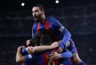 Barcelona's Arda Turan, top, celebrates with his teammates after Luis Suarez, foreground, scored the opening goal during the the Copa del Rey semifinal second leg soccer match between FC Barcelona and Atletico Madrid at the Camp Nou stadium in Barcelona, Spain, Tuesday Feb. 7, 2017. (AP Photo/Manu Fernandez)