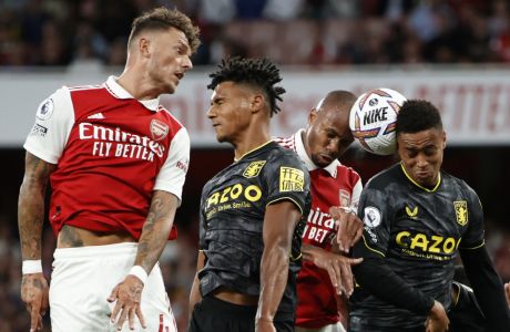 Arsenal's Ben White, left, and Gabriel, second from right, challenge for the ball with Aston Villa's Ollie Watkins, second from left, and Boubacar Kamara during the English Premier League soccer match between Arsenal and Aston Villa at the Emirates Stadium in London, Wednesday, Aug. 31, 2022. (AP Photo/David Cliff)