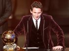 Argentina's Lionel Messi is awarded the prize for the soccer player of the year 2011 at the FIFA Ballon d'Or awarding ceremony in Zurich, Switzerland, Monday, Jan. 9, 2012. (AP Photo/Michael Probst)