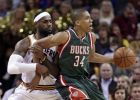 Cleveland Cavaliers' LeBron James, left, and Milwaukee Bucks' Giannis Antetokounmpo (34), from Greece, get tangled up in the first quarter of an NBA basketball game Tuesday, Dec. 2, 2014, in Cleveland. (AP Photo/Tony Dejak)