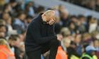 Manchester City's head coach Pep Guardiola reacts during the English Premier League soccer match between Manchester City and West Ham United at Etihad stadium in Manchester, England, Wednesday, May 3, 2023. (AP Photo/Dave Thompson)