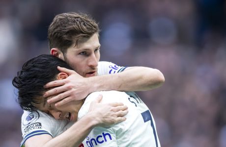 Tottenham's Ben Davies embraces Tottenham's Son Heung-min after scoring his sides third goal during the Premier League soccer match between Tottenham and Nottingham Forest at The Tottenham Hotspur Stadium in London, England, Saturday March 12th, 2023. (AP Photo/Leila Coker)