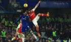 Chelsea's Tammy Abraham, left, challenges for the ball with Arsenal's Gabriel Martinelli during the English Premier League soccer match between Chelsea and Arsenal at Stamford Bridge stadium in London England, Tuesday, Jan. 21, 2020. (AP Photo/Leila Coker)