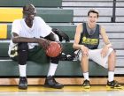 Tacko Fall is a 7' 4" tall basketball player at Liberty Christian Prep in Tavares. He is pictured laughing with teammate Andrew Baker (right) during basketball practice at the school on Friday, November 22, 2013. (Stephen M. Dowell/Orlando Sentinel)