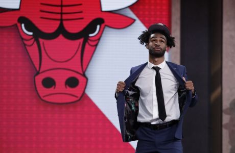 North Carolina's Coby White walks onstage after the Chicago Bulls selected him as the seventh overall in the NBA basketball draft Thursday, June 20, 2019, in New York. (AP Photo/Julio Cortez)