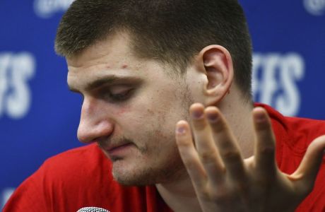 Denver Nuggets center Nikola Jokic speaks after the second half of Game 7 of an NBA basketball second-round playoff series Sunday, May 12, 2019, in Denver. The Trail Blazers won 100-96. (AP Photo/John Leyba)