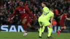 Liverpool's Georginio Wijnaldum, left, celebrates scoring his side's third goal of the game during the Champions League Semi Final, second leg soccer match between Liverpool and Barcelona at Anfield, Liverpool, England, Tuesday, May 7, 2019. (Peter Byrne/PA via AP)