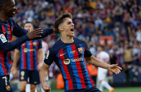 Barcelona's Gavi celebrates after scoring his side's third goal during a Spanish La Liga soccer match between Barcelona and Mallorca at the Camp Nou stadium in Barcelona, Spain, Sunday, May 28, 2023. (AP Photo/Joan Monfort)