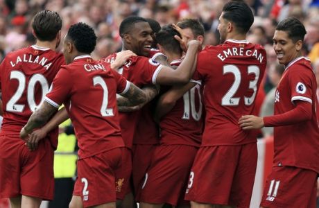 Liverpool's Philippe Coutinho, center no. 10, celebrates scoring against Middlesbrough with teammates during the English Premier League soccer match at Anfield, Liverpool, England, Sunday May 21, 2017. (Peter Byrne/PA via AP)